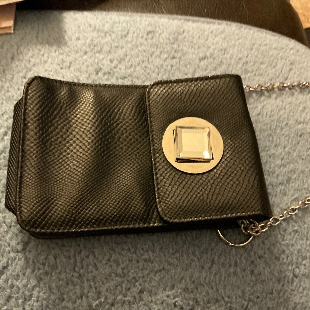 Black cell phone bag with crystal closure and gold chain